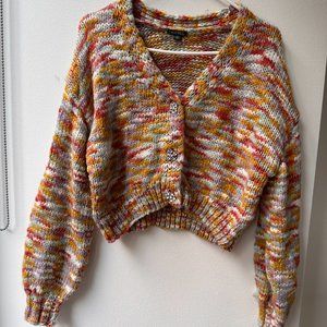 Stylish knitted sweater with rhinestone buttons